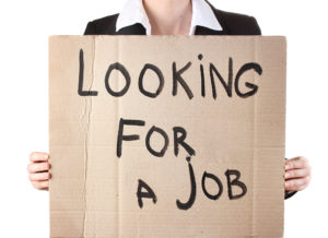 This person doesnt have an interview winning resume, so she is standing out with a cardboard sign.